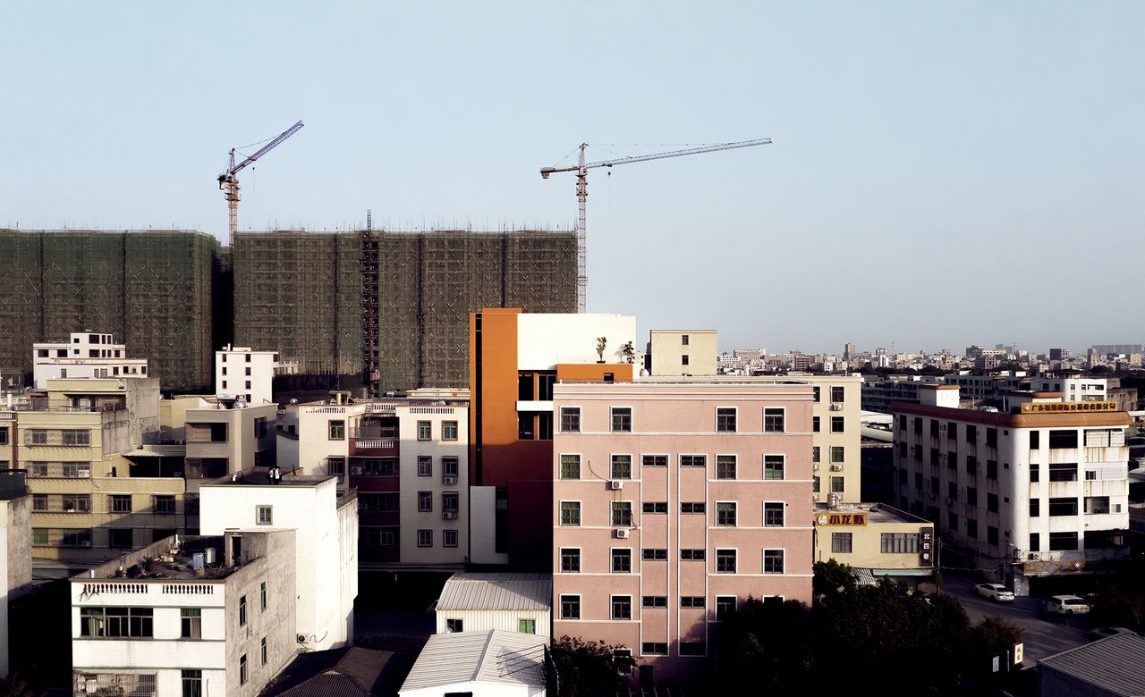 Red box house in China as seen within the cityscape 