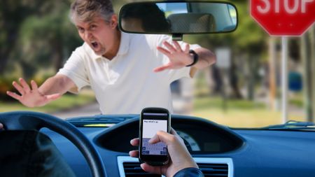 Someone using their phone while driving
