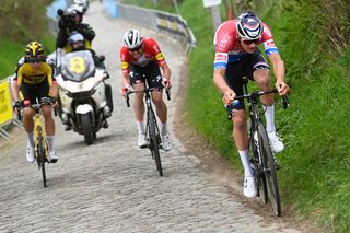 Van der Poel, Van Aert, and Asgreen tackle the cobbles during the 2021 Tour of Flanders