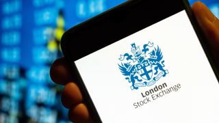In this photo illustration, the British London Stock Exchange index logo is displayed on a smartphone screen.