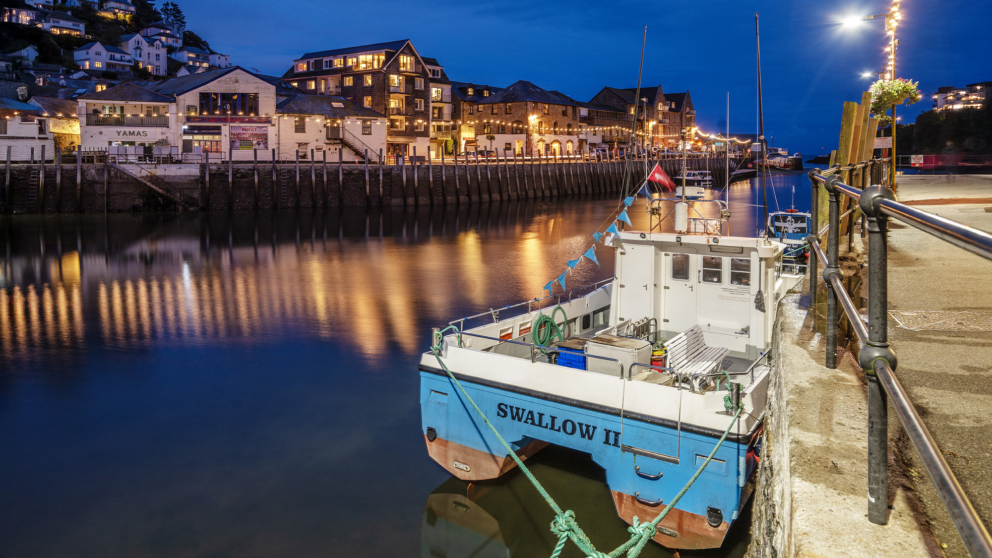 Long exposure of a boat in a harbour
