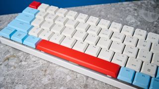 A Cherry MX LP 2.1 low-profile keyboard with red, white and blue keycaps