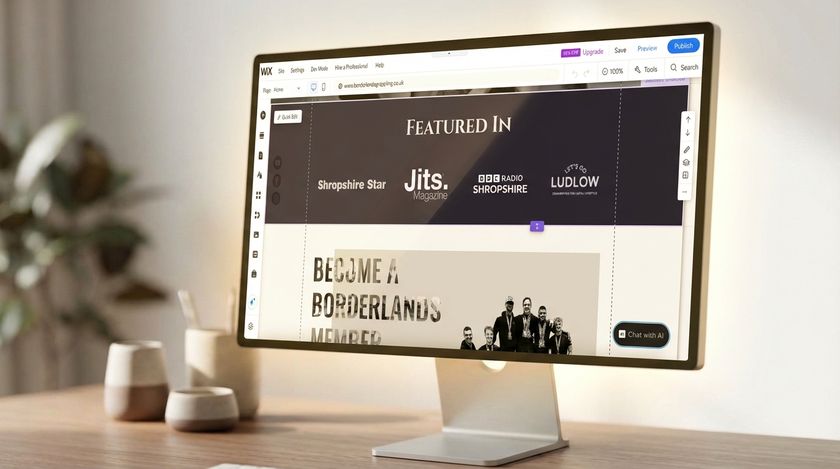 A screenshot of the Borderlands Grappling website built on Wix on a mac on top of a modern desk