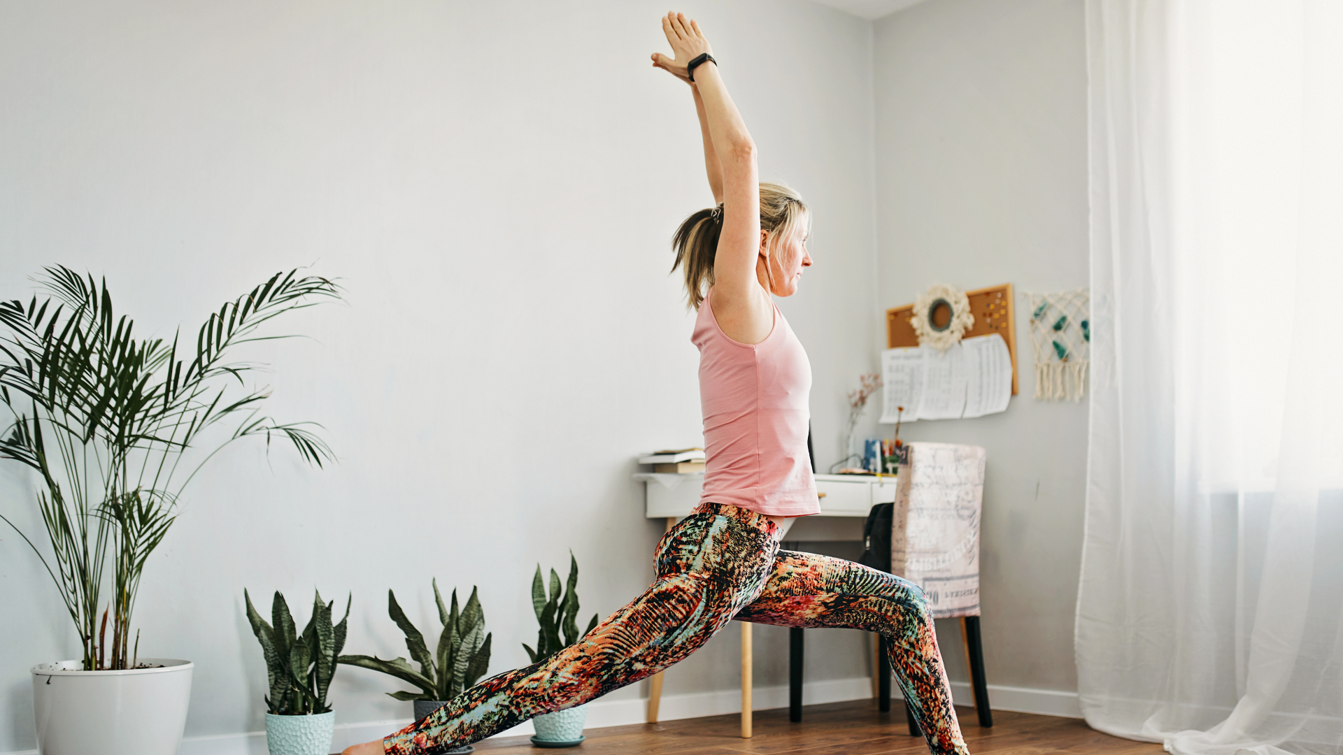 woman doing yoga in living room at home