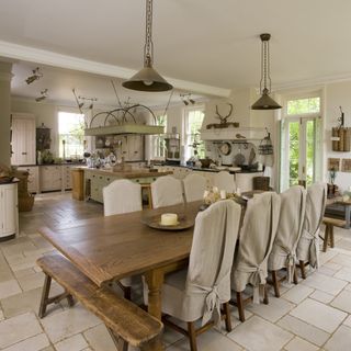 kitchen with white walls dinning table with chair