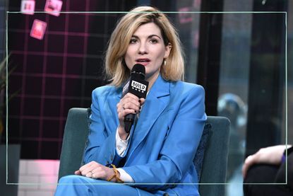 Jodie Whittaker speaking into a microphone wearing a blue suit