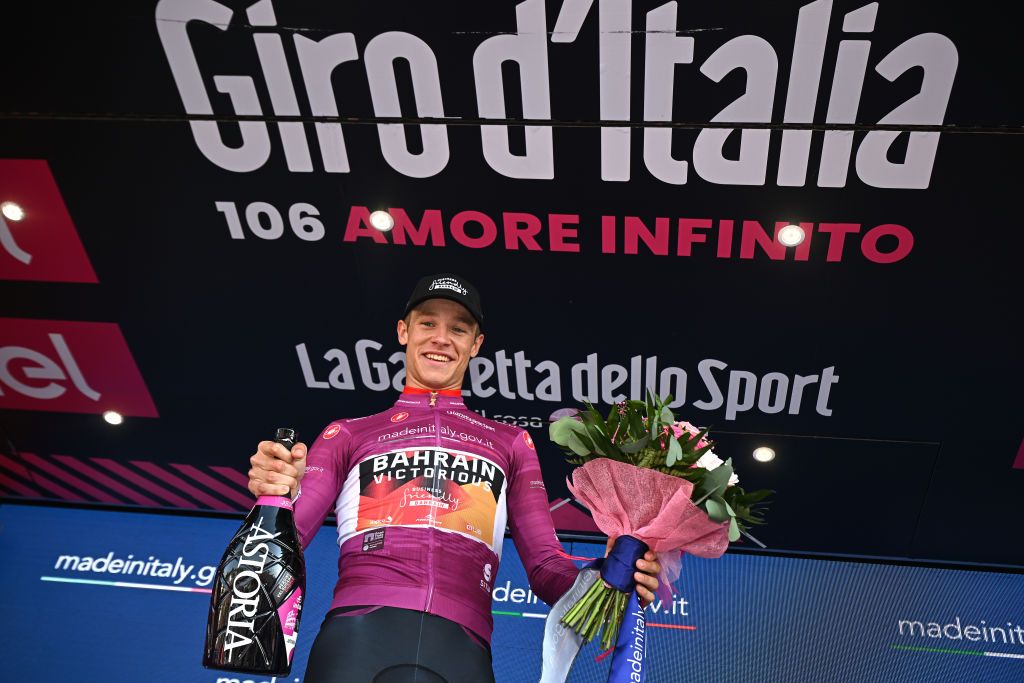 CAORLE ITALY MAY 24 Jonathan Milan of Italy and Team Bahrain Victorious Purple Points Jersey celebrates at podium during the the 106th Giro dItalia 2023 Stage 17 a 197km stage from Pergine Valsugana to Caorle UCIWT on May 24 2023 in Caorle Italy Photo by Stuart FranklinGetty Images