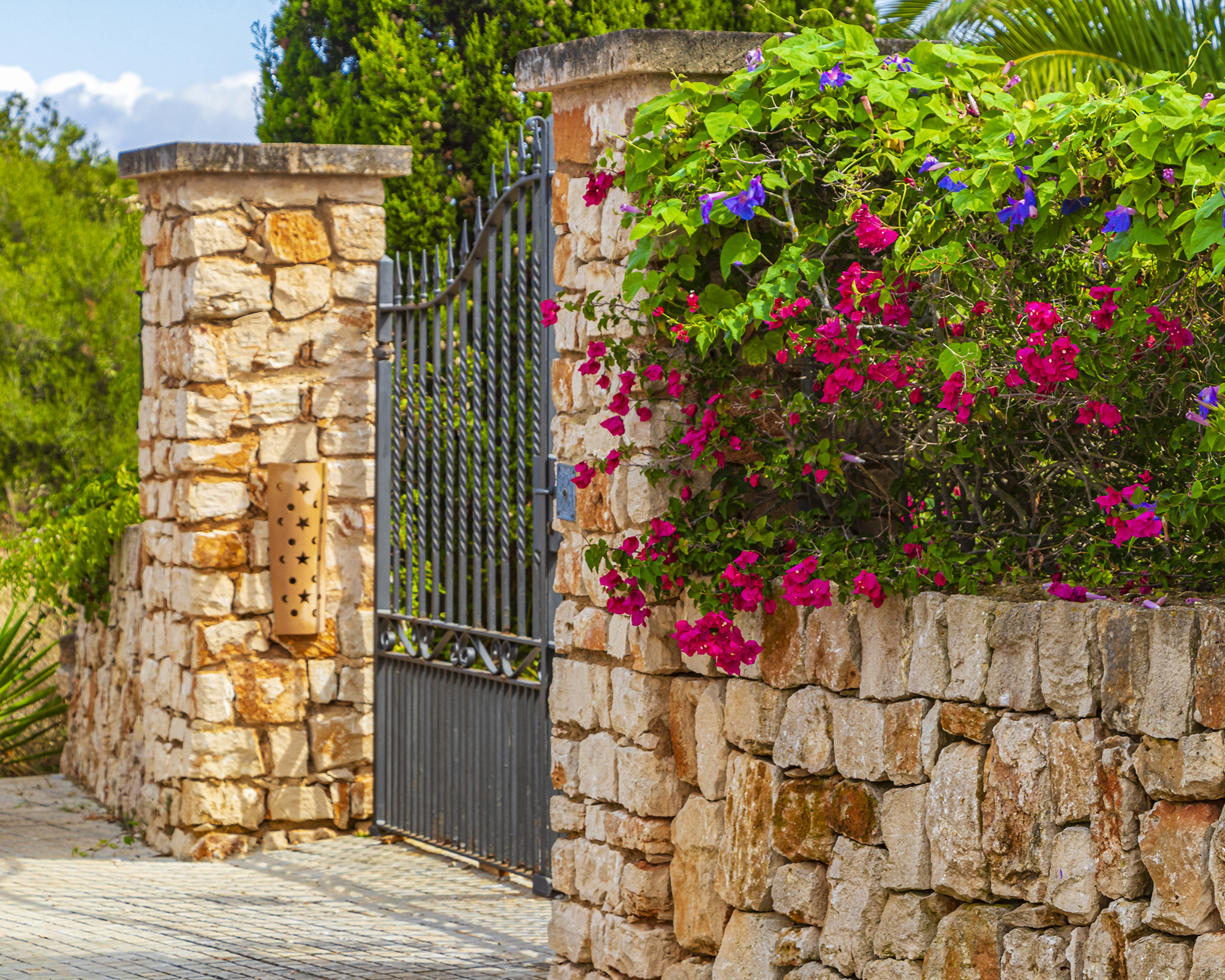 Front yard stone wall with gate