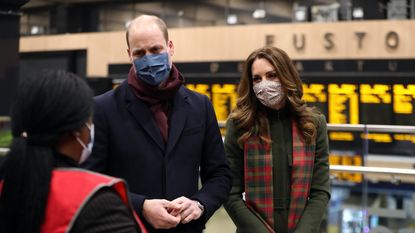 Prince William, Duke of Cambridge and Catherine, Duchess of Cambridge speak to transport workers at London Euston Station