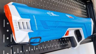 SpyraThree hanging on a metal wall bracket