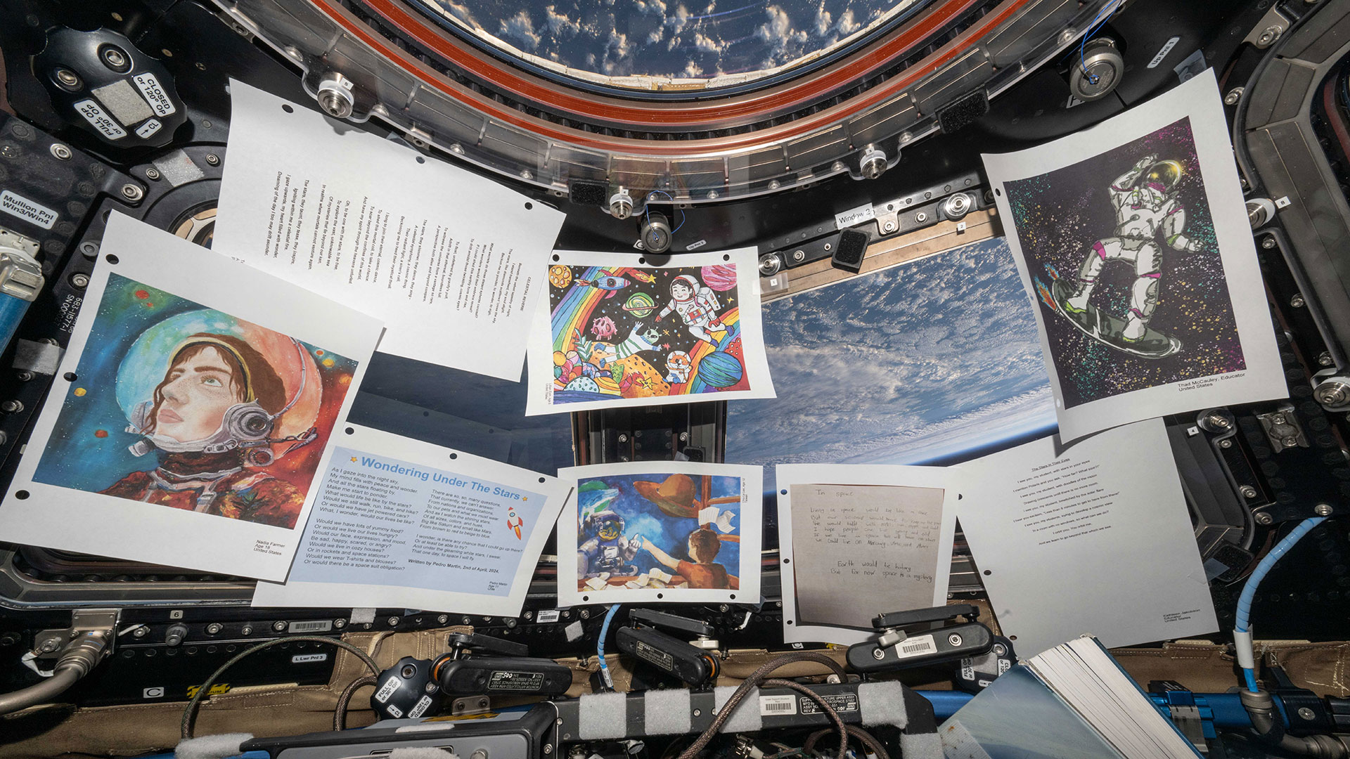 Students' contest-winning pen, paint and poetry works shown aboard International Space Station