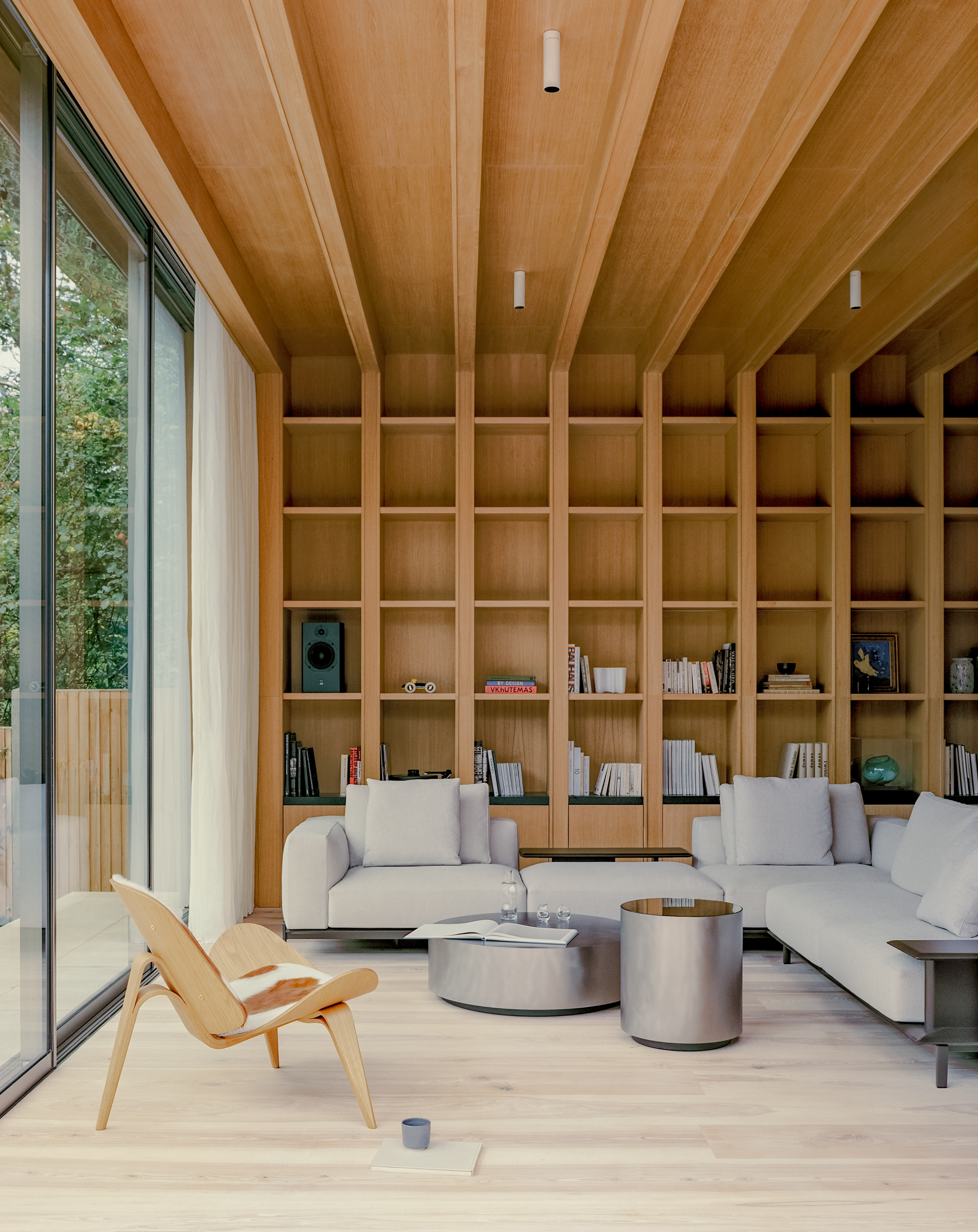views of Panoramic House by Mata with a timber clad extension and built in furniture