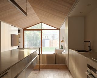 kitchen and pitched roof at Everden house by archollab
