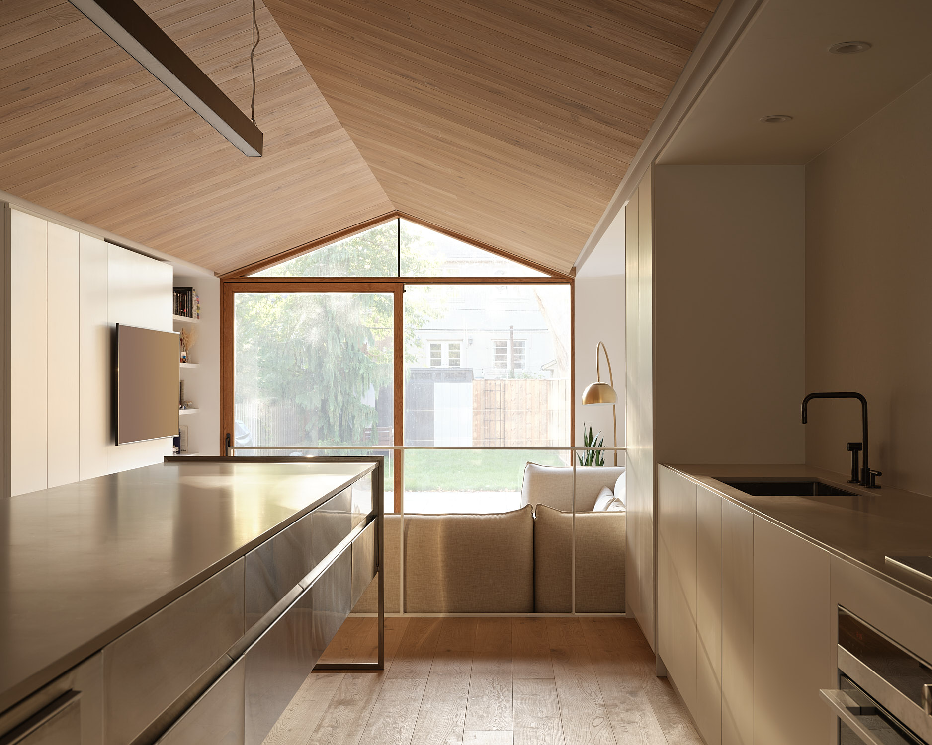 kitchen and pitched roof at Everden house by archollab
