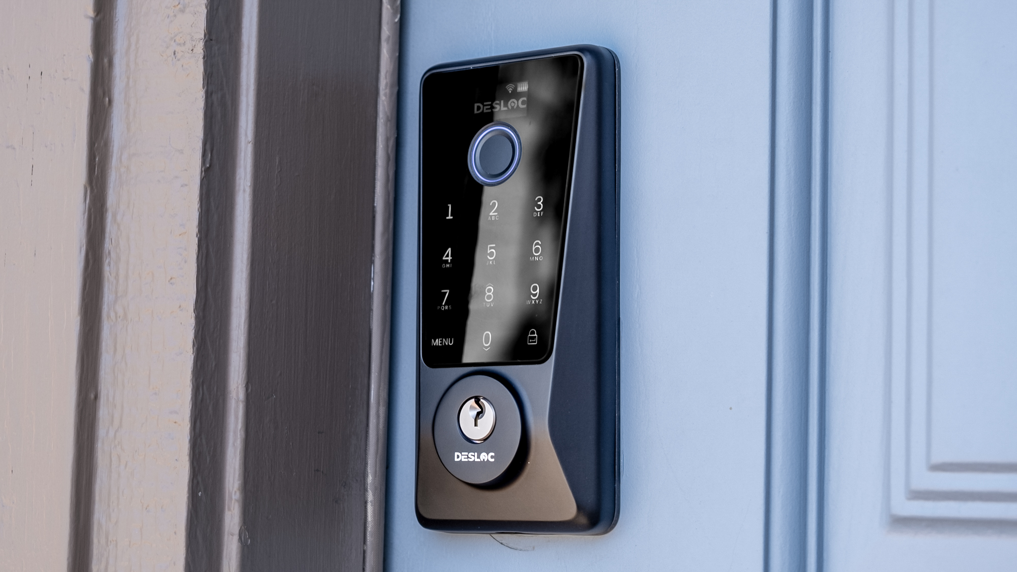 Exterior shot of the Desloc D110 Plus mounted on a blue door