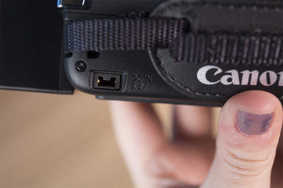 The Canon Vixia charges via this small port in the side.