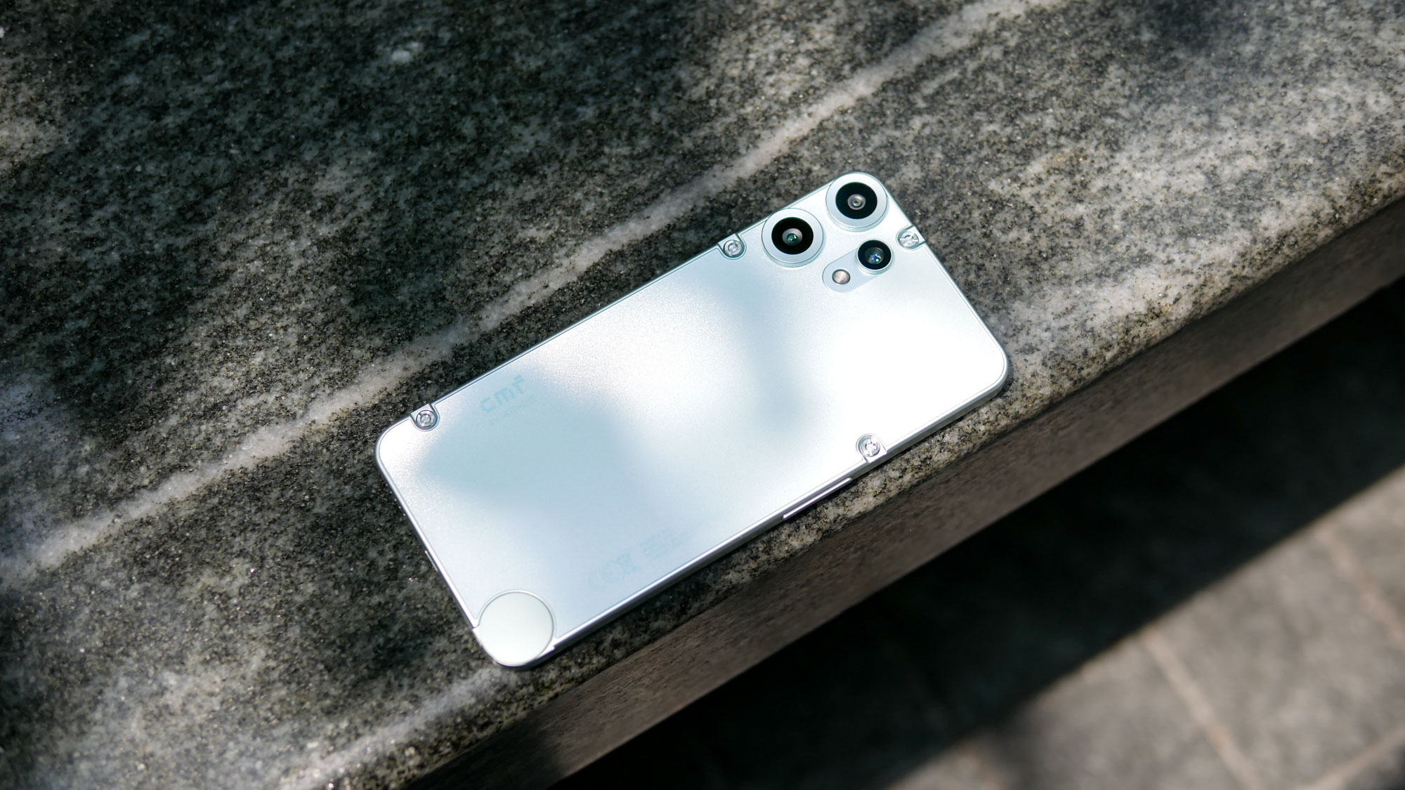 CMF Phone 2 Pro on top of bench laid down to show its back cover.