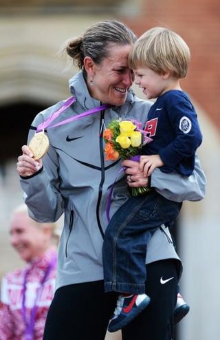 Olympic time trial champion Kristin Armstrong (USA) on the podium with her son, Lucas.