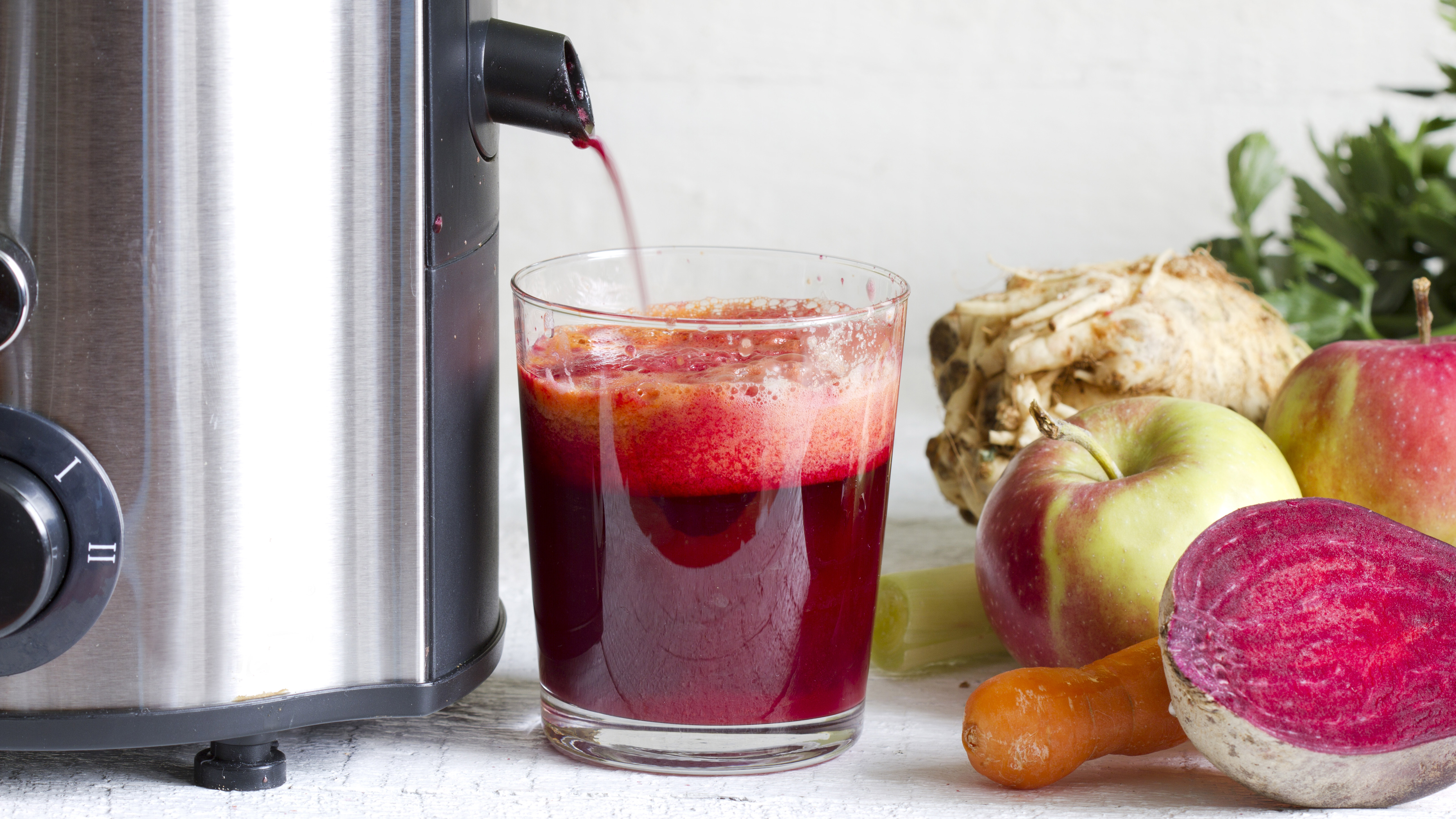 a Juicer being used to juice fruit