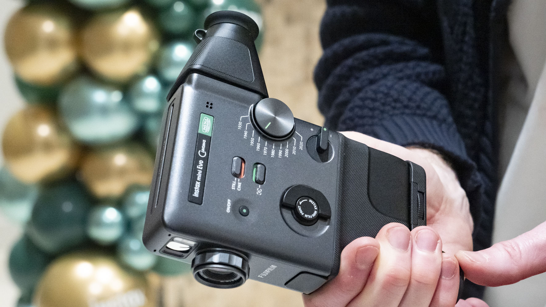 Fujifilm Instax Mini Evo Cinema camera in user's hands