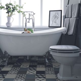 Black and white bathroom with freestanding bath