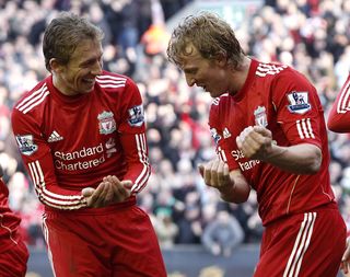 Liverpool’s Dirk Kuyt (right) celebrates completing his hat-trick with team-mate Lucas Leiva