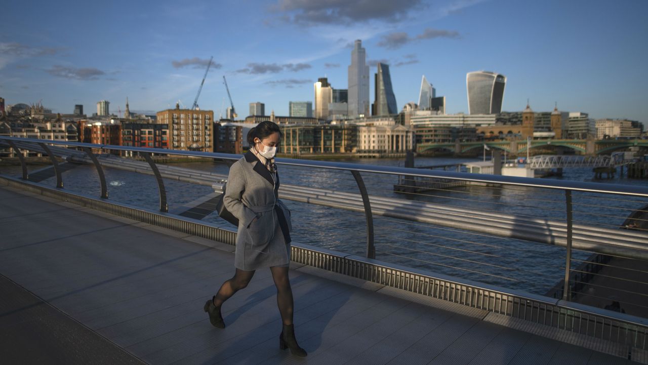 A masked pedestrian in London