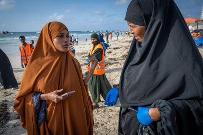 Somali reporter Kiin Hasan Fakat, a correspondent for Somalias first-ever, all-women news outlet, called Bilan, interviews Sirad Mohamed Nur, director of the Mama Ugaaso Foundation