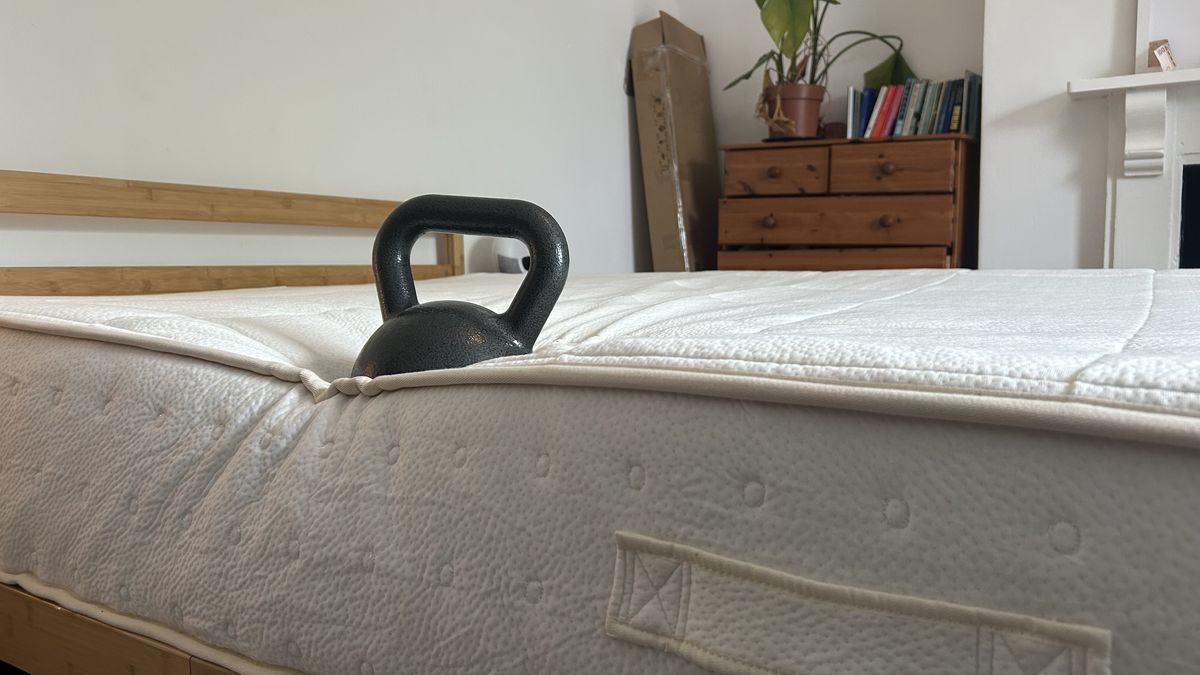A weight on the edge of the Awara Classic mattress to test edge support