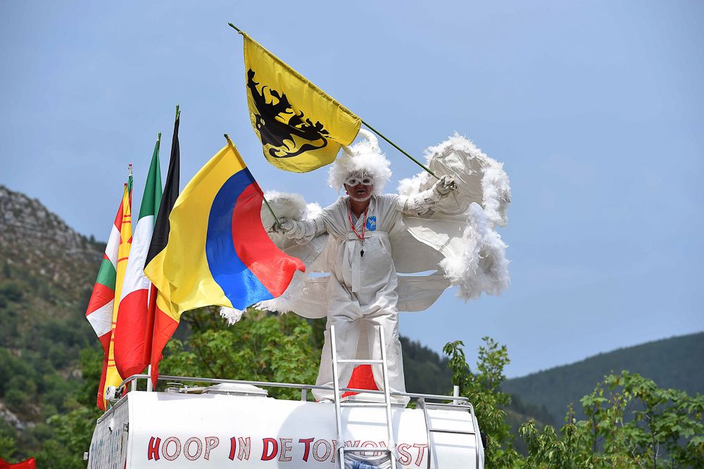A spectator in costume along the stage 14 route.