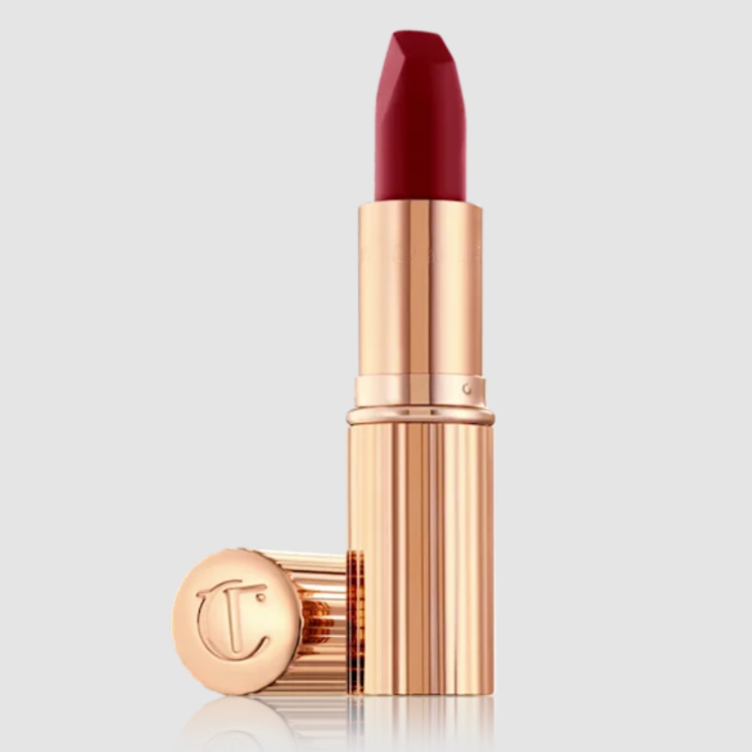 A product shot of Charlotte Tilbury Matte Revolution lipstick in Love Liberty, on a grey background