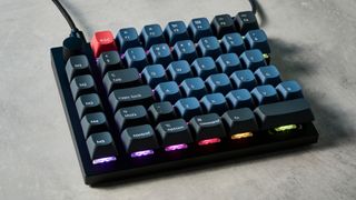 A carbon black Keychron Q11 split ergonomic keyboard