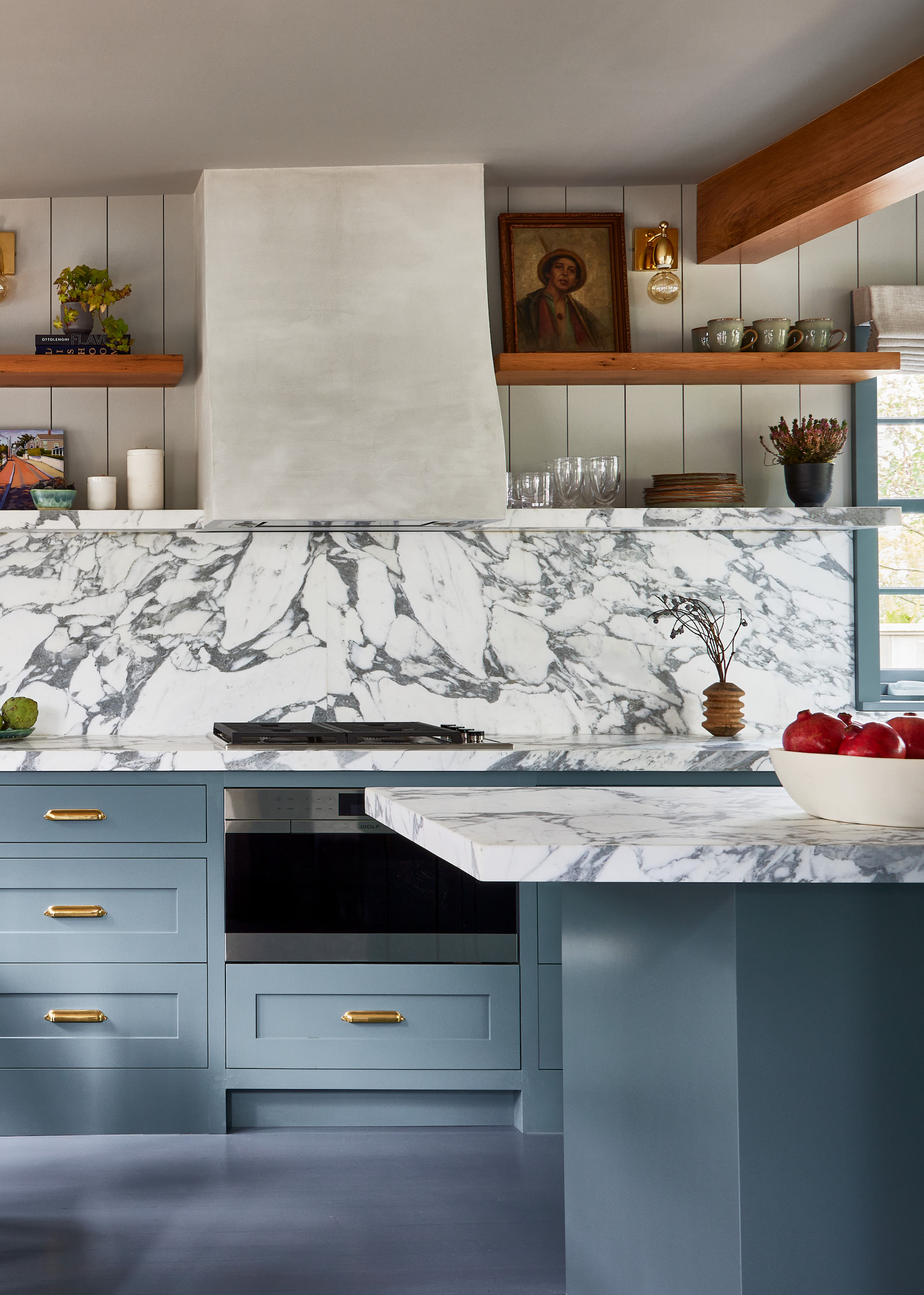 blue kitchen with marble surfaces