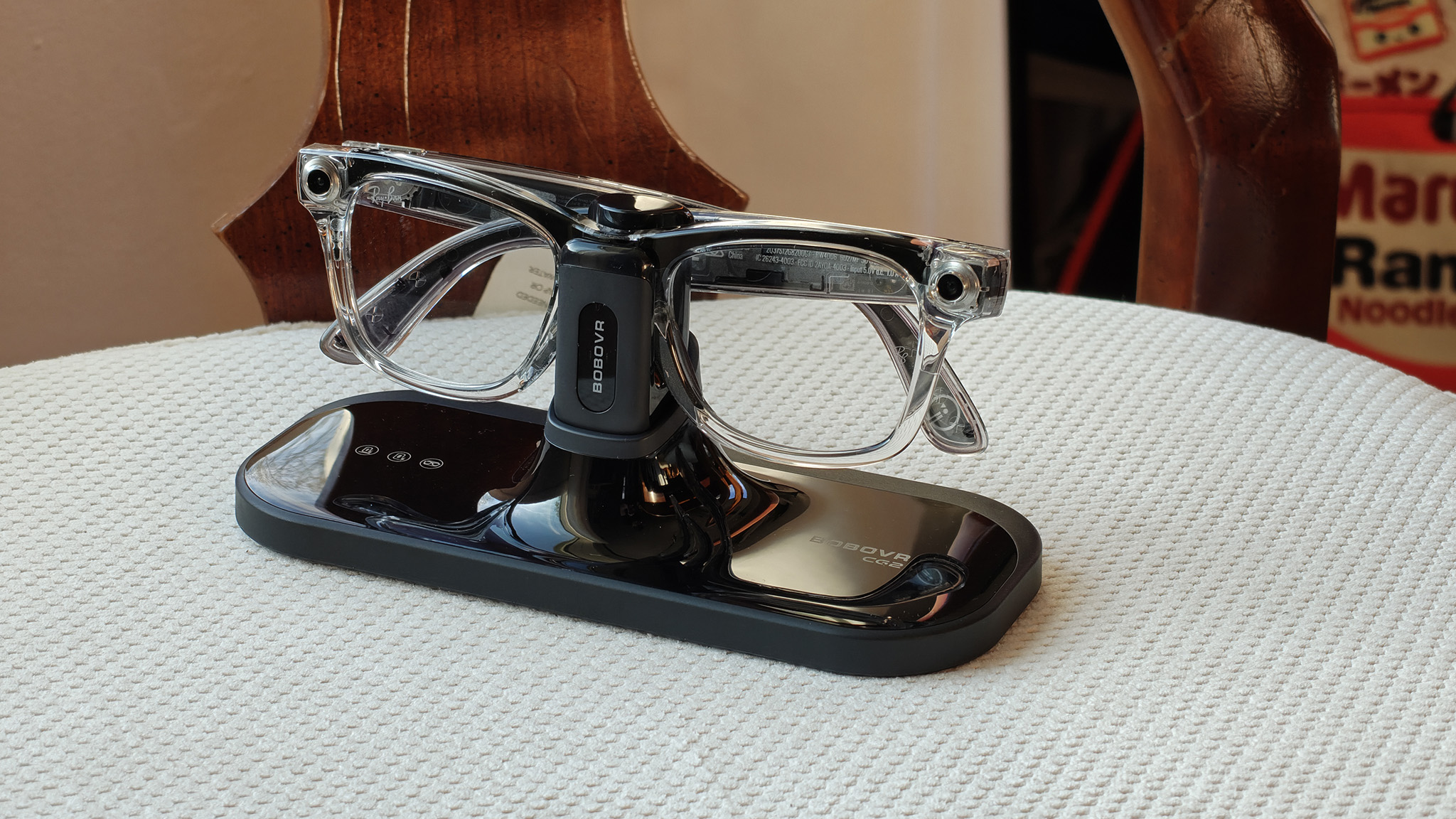 Charging a pair of transparent Ray-Ban Meta Smart Glasses (Gen 1) on the BoboVR CG2 charging stand