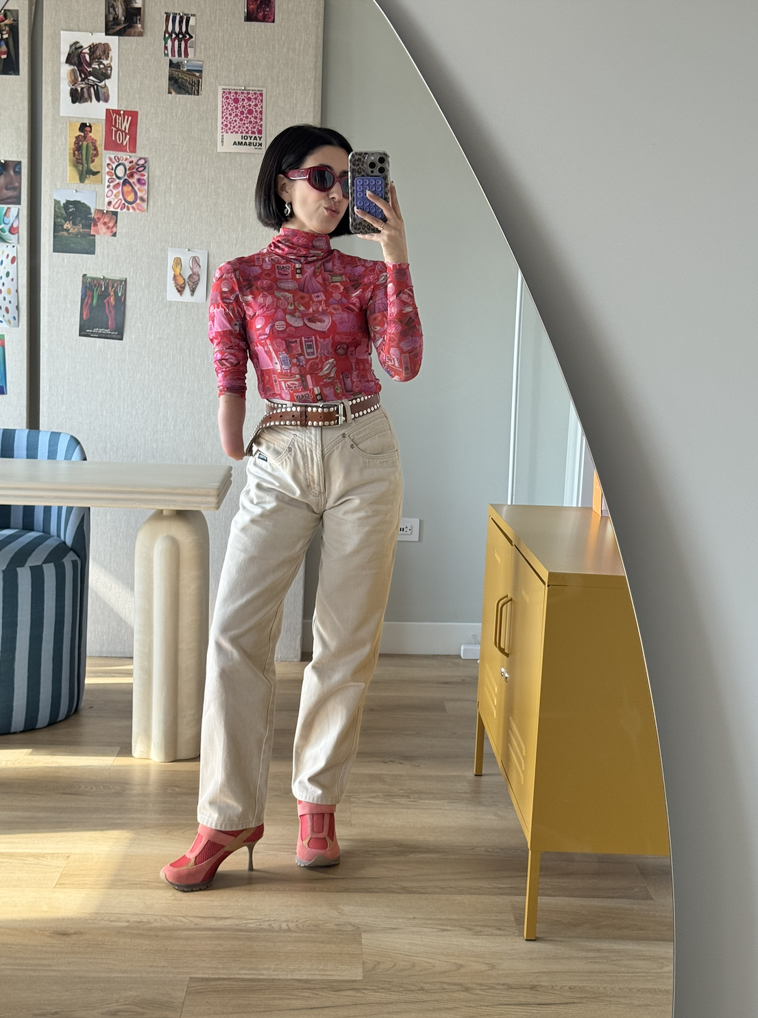April Lockhart wearing a tight top and white jeans