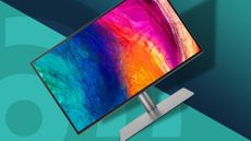 A BenQ PD2725U, the best monitor in 2024, against a teal techradar background.
