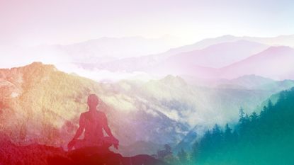 outline of a woman in yoga pose overlooking the himalayas