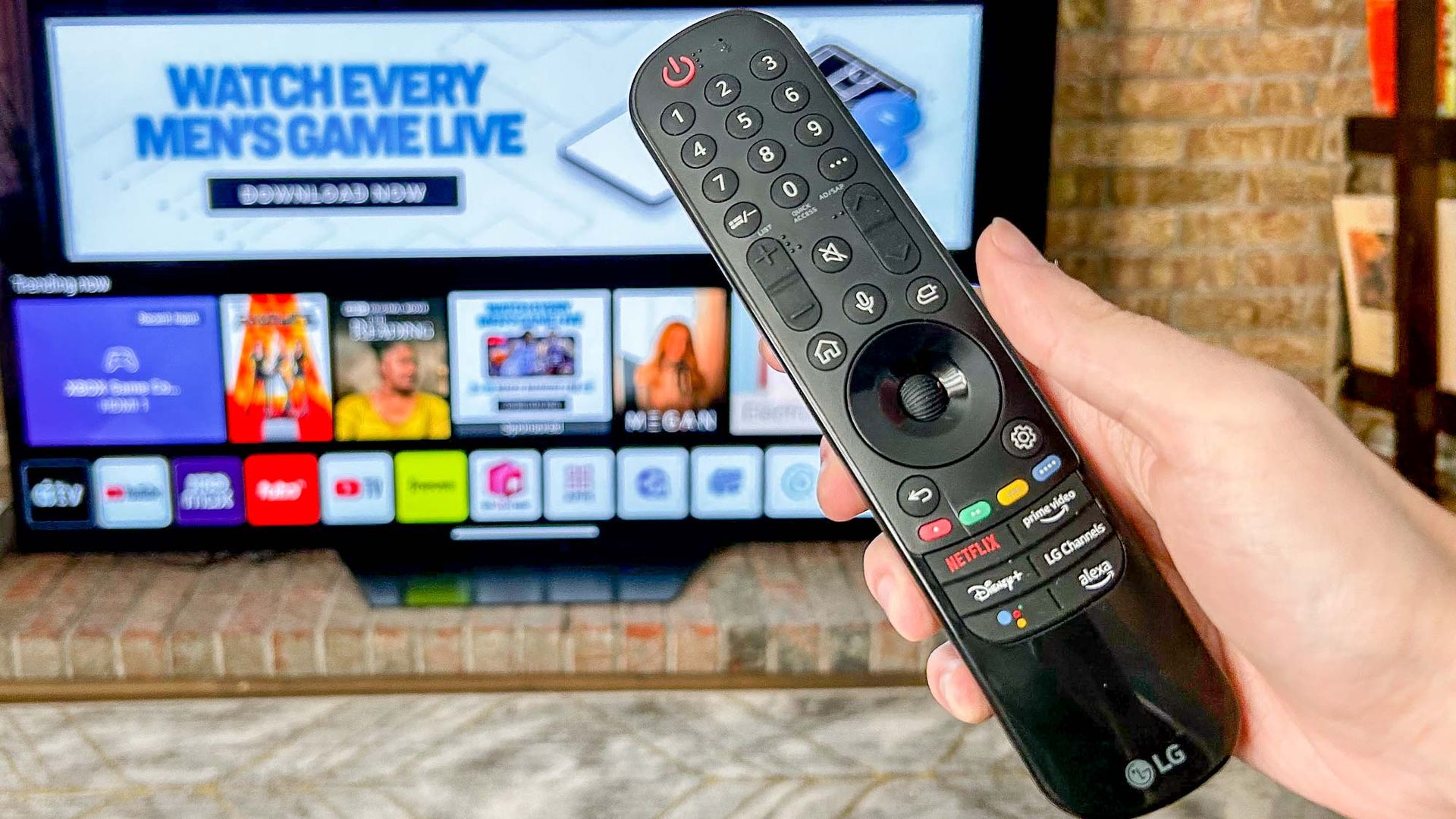 LG B2 OLED TV shown against a brick wall in a living room