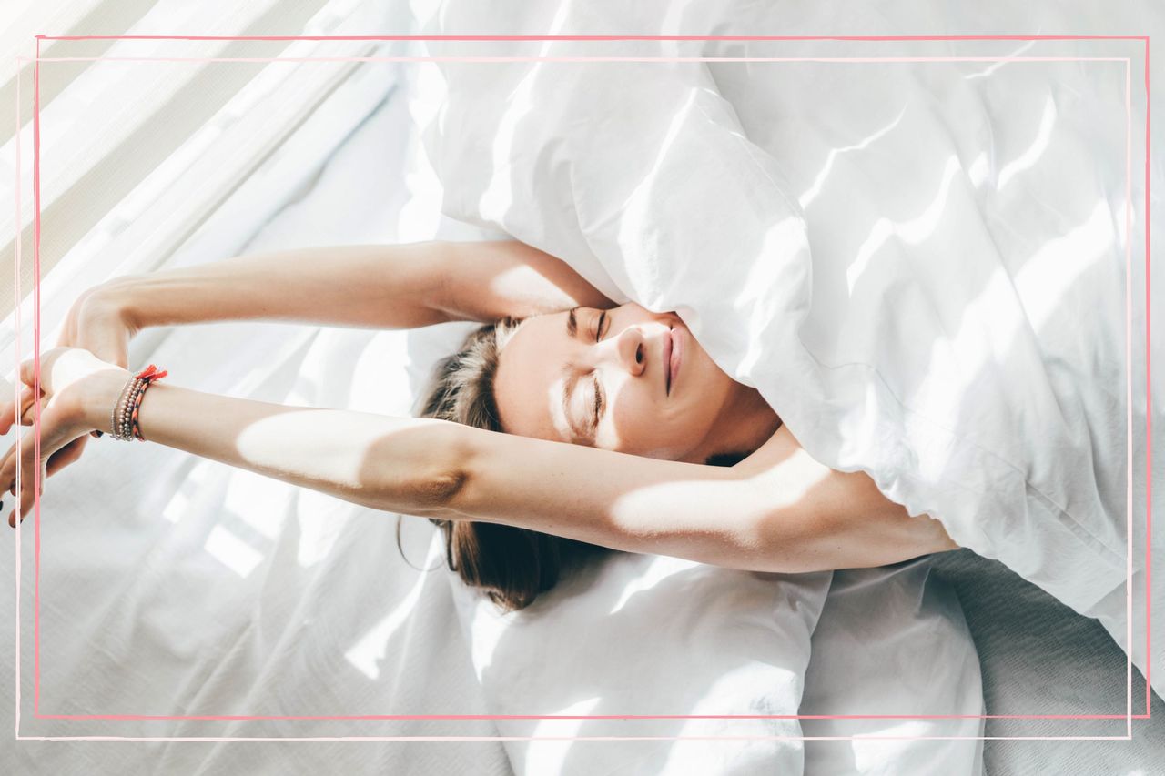 Woman stretching on bed