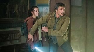 (L to R) Bella Ramsey as Ellie and Pedro Pascal as Joel, navigating a museum, in The Last of Us on HBO