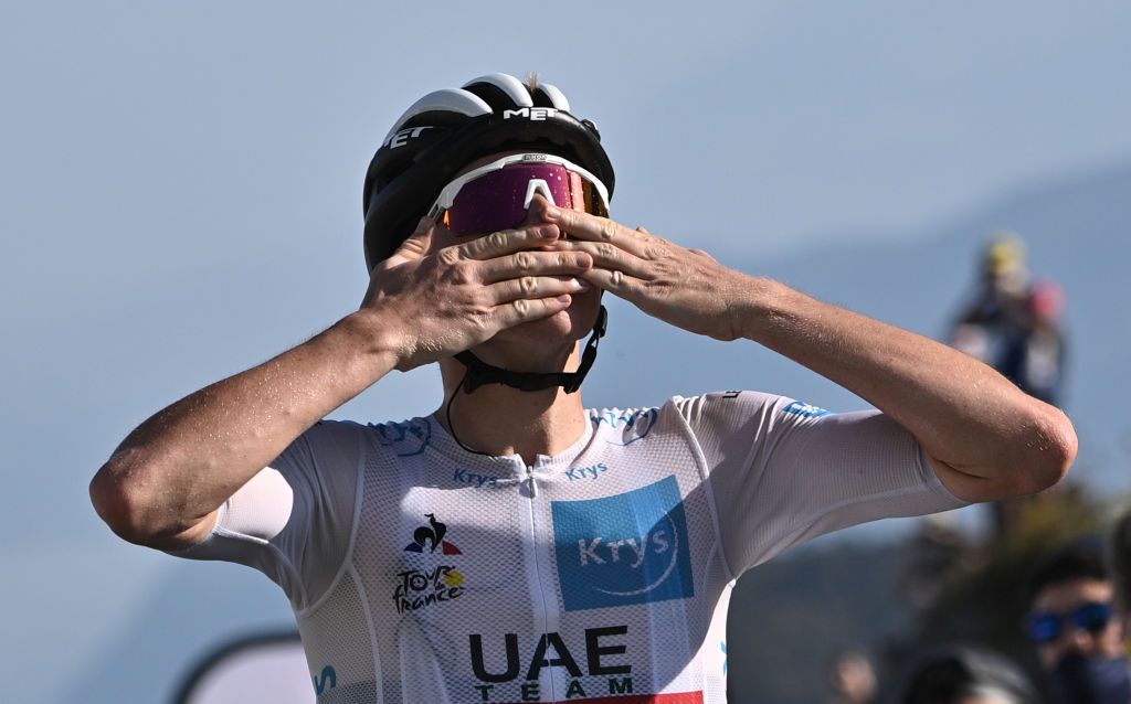 Stage winner Team Jumbo rider Team UAE Emirates rider Slovenias Tadej Pogacar celebrates as he crosses the finish line at the Grand Colombier pass during the 15th stage of the 107th edition of the Tour de France cycling race 175 km between Lyon and Grand Colombier on September 13 2020 Photo by AnneChristine POUJOULAT POOL AFP Photo by ANNECHRISTINE POUJOULATPOOLAFP via Getty Images