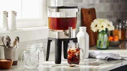 one of the best cold brew coffee maker models (the KitchenAid) on a countertop with milk and jars around it