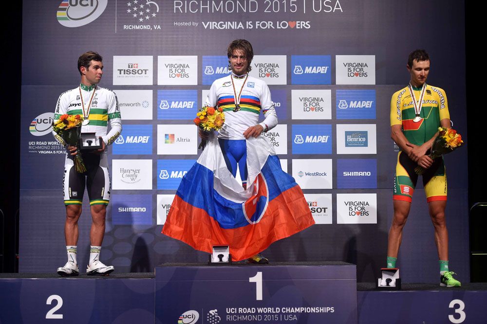 Peter Sagan holds the Slovakian flag as the new World Champion