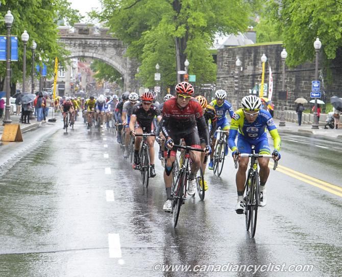 The Tour de Beauce peloton climbs in the rain.