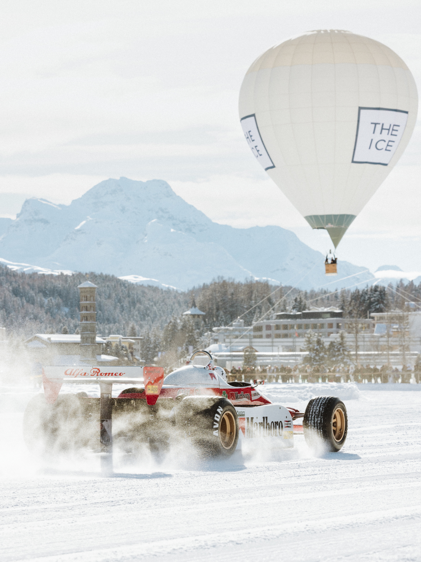 A vintage F1 car does a burnout ironically on the ice