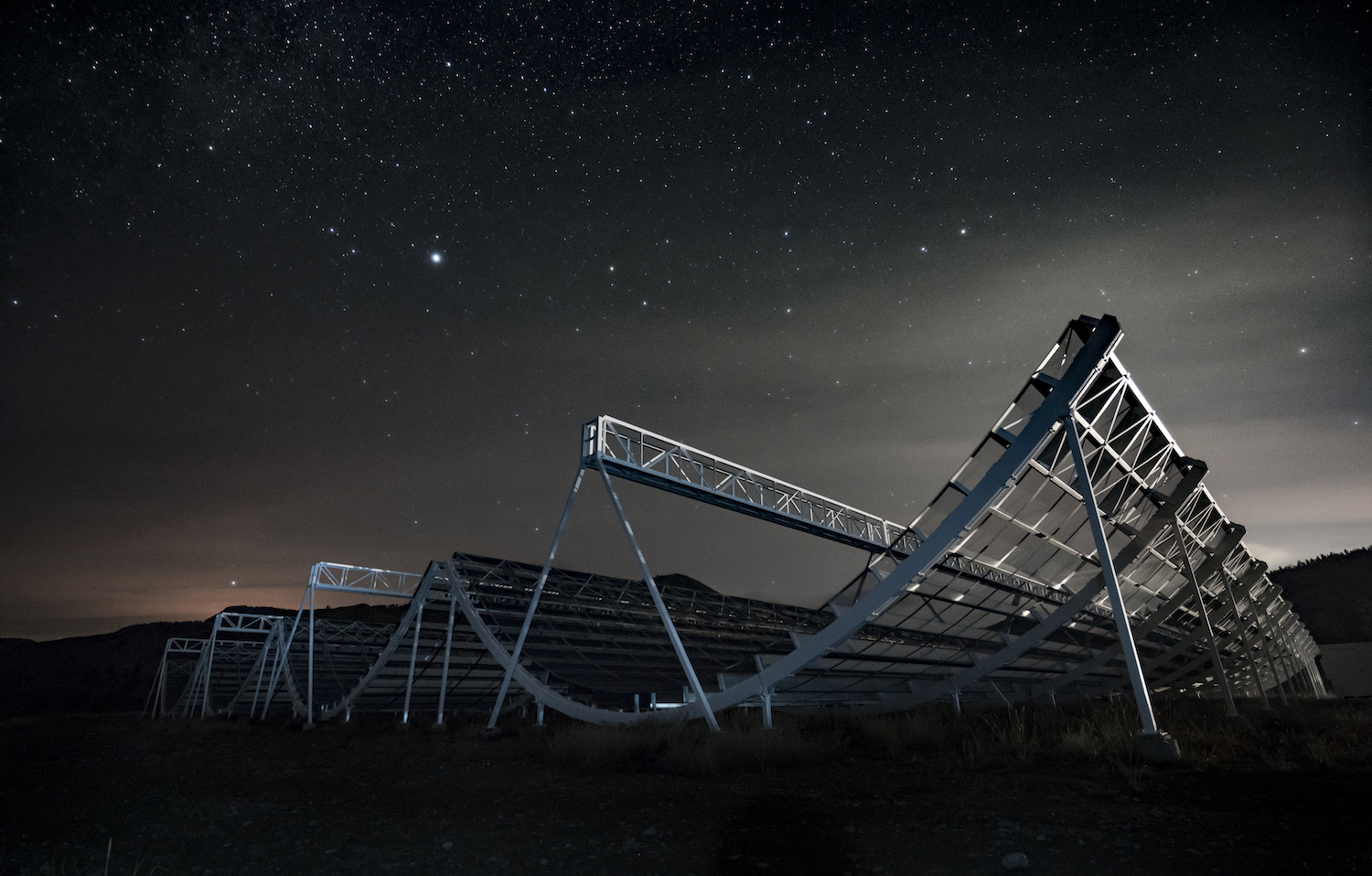 The CHIME radio telescope at night.