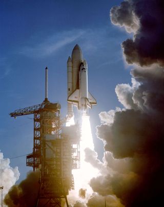 A remote camera at the Kennedy Space Center's Launch Pad 39A captured this scene as the maiden flight of space shuttle Columbia begins on April 12, 1981. Astronauts John W. Young, STS-1 commander, and Robert L. Crippen, pilot, were aboard Columbia as it b