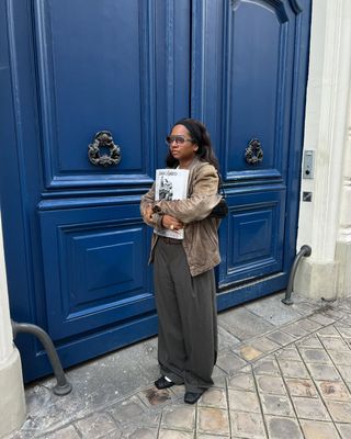 french woman wearing brown leather jacket outfit