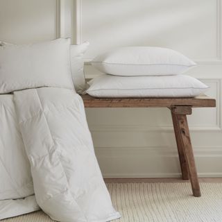 White pillows on low wooden table