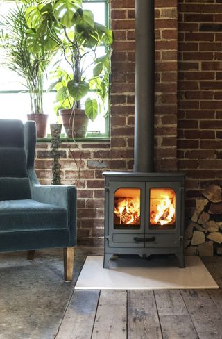 Wood-burning stove in living room by Charnwood